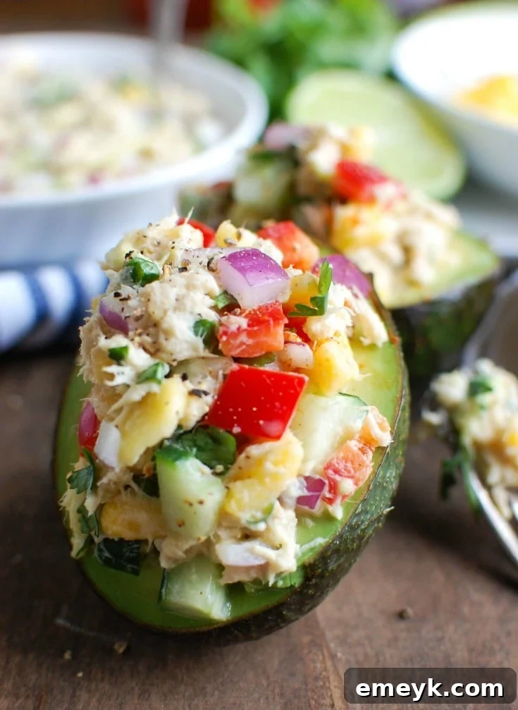 Tropical Tuna Stuffed Avocado is the perfect, quick and healthy lunch at your desk or on-the-go. Fresh mango, cilantro, fresh vegetables and lime juice is mixed with Sold White Albacore Tuna and Greek Yogurt and then stuffed in a delicious avocado. 