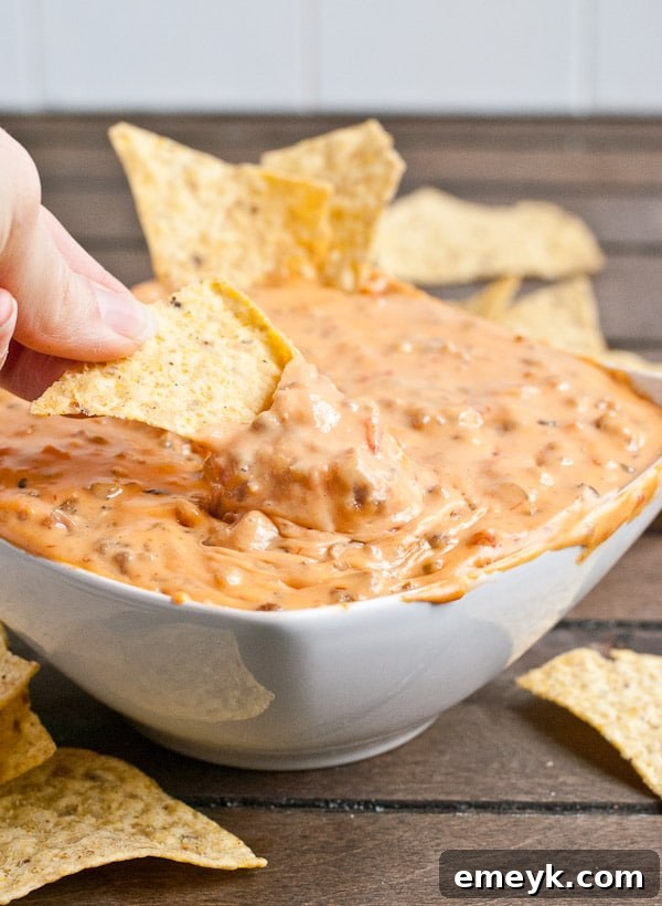 29 Unbeatable Game Day Dips 11 3 Ingredient Slow Cooker Queso, a super simple yet satisfying cheesy dip.