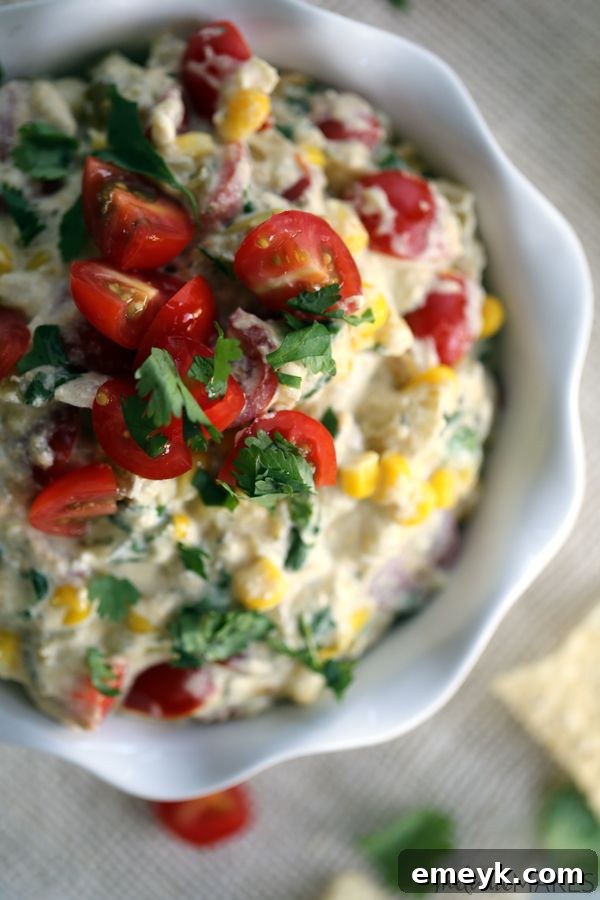 29 Unbeatable Game Day Dips 31 Flavorful Slow Cooker Salsa Verde Corn Dip, a vibrant and easy appetizer.