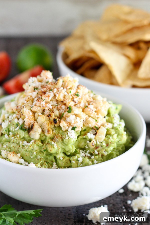 29 Unbeatable Game Day Dips 25 Vibrant Mexican Street Corn Guacamole, a creative fusion of two beloved dips.