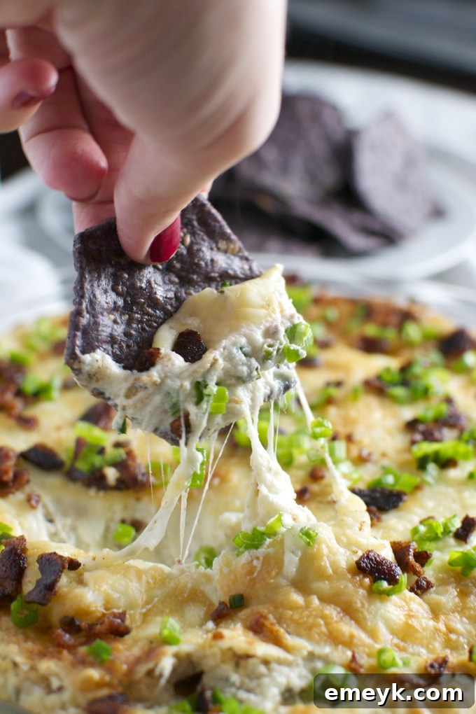 29 Unbeatable Game Day Dips 17 Garlic Bacon Cheese Dip, a decadent and savory combination for garlic and bacon lovers.