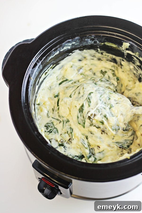 29 Unbeatable Game Day Dips 30 Classic Slow Cooker Spinach Artichoke Dip, always a crowd-pleaser.