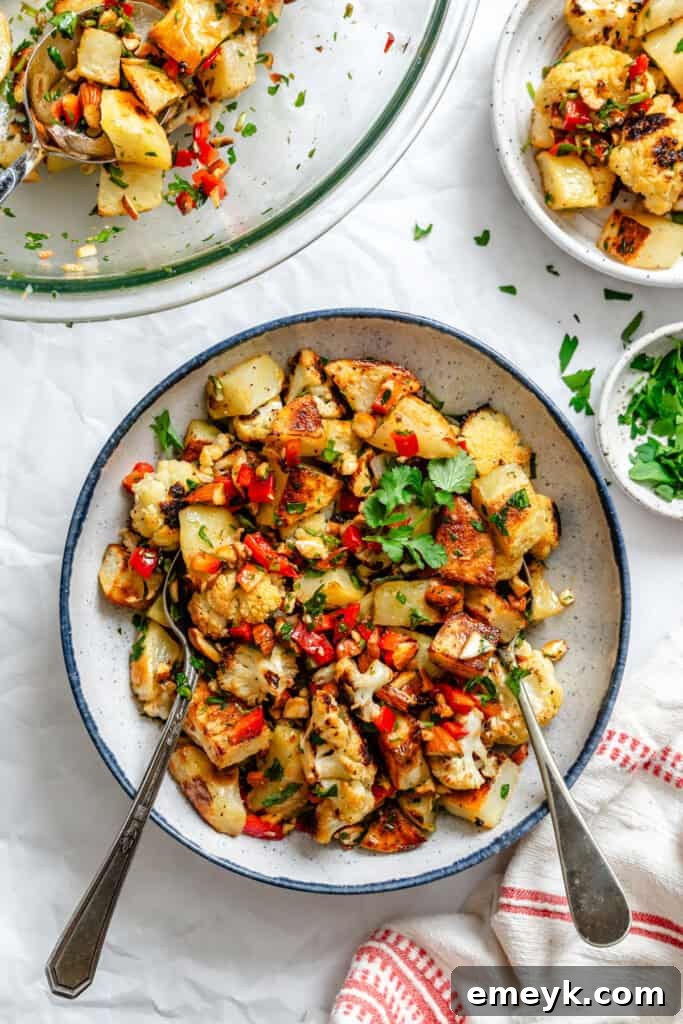 Cauliflower Potato Salad in bowl with spoon