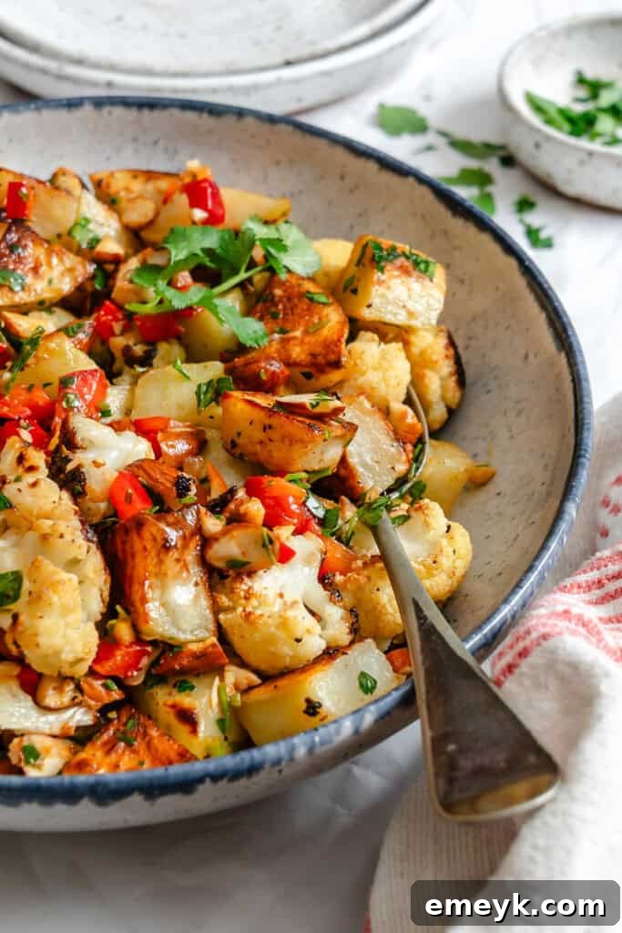 Cauliflower Potato Salad in a bowl with spoon
