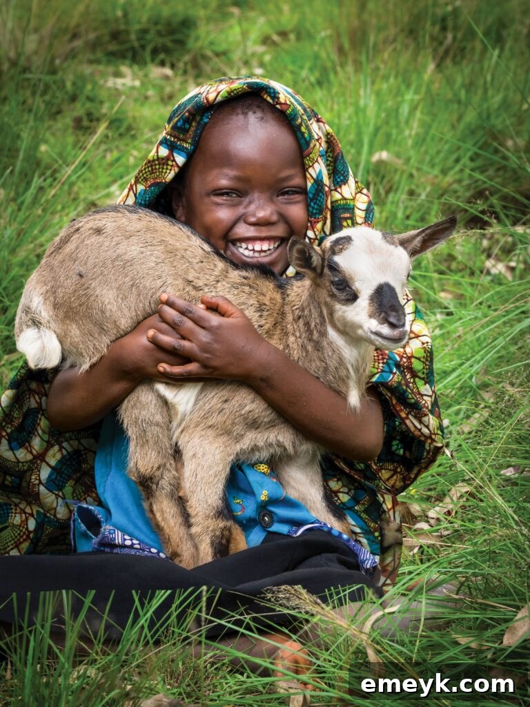 This Holiday Season: Give Back and Win! 2 Chanian Niyonyishu, a 5-year-old girl in Gasorwe, Burundi, pictured with a baby goat. Her mother, Zuena Mukeshimana, emphasizes the benefit: “With the goat we received, we can now fertilize our ground for better food production.”