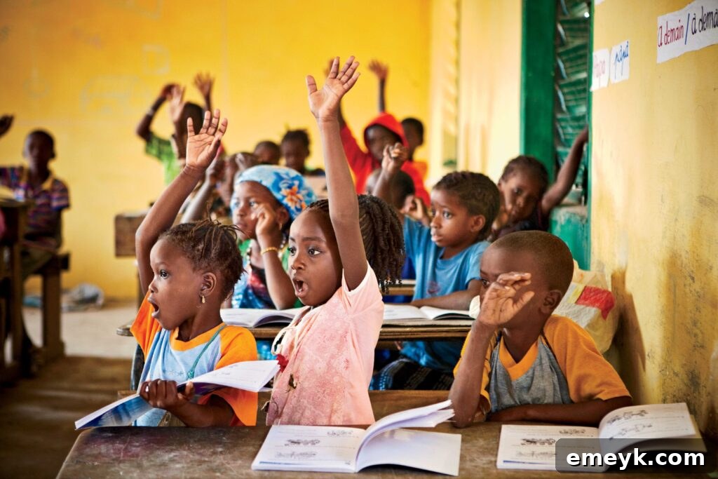 This Holiday Season: Give Back and Win! 3 School classroom in Kandia ADP. Excited kids interacting with lesson.