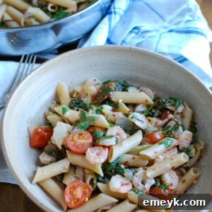 Shrimp Kale Artichoke Pasta is light, healthy and an easy meal idea. Shrimp, kale, artichokes, tomatoes and pasta and tossed in a light lemon sauce that will leave your family asking for seconds!