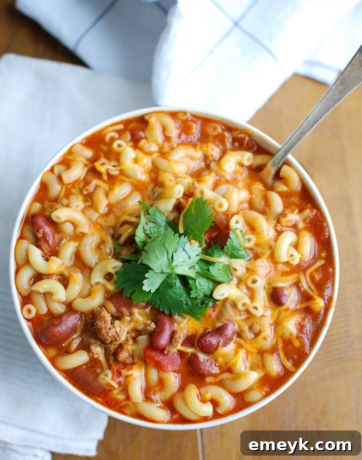 Close-up of Crock-Pot Turkey Chili Mac and Cheese, showcasing the rich chili and melted cheese, making it an inviting meal.