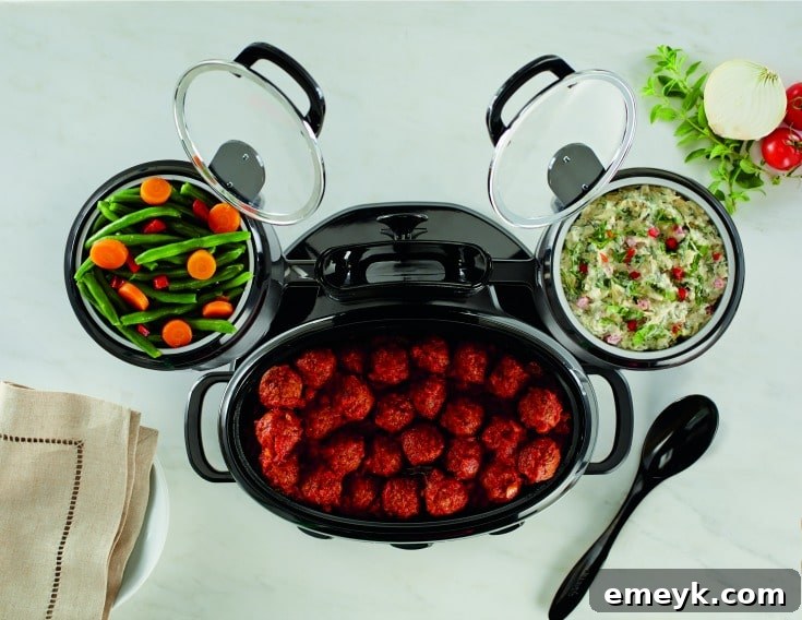 The Crock-Pot Swing and Serve with its crocks swung open for easy serving, highlighting its innovative design and convenience.