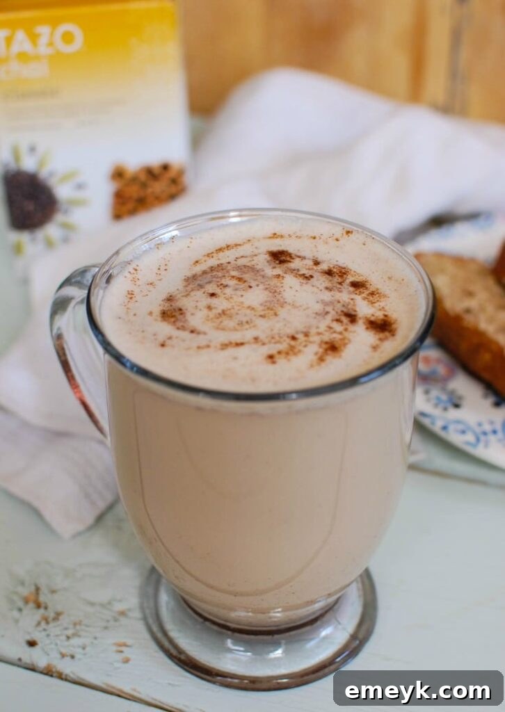 A warm and inviting Homemade Chai Tea Latte, featuring rich spices like cinnamon, cloves, ginger, and nutmeg, blended with creamy milk for a cozy drink.