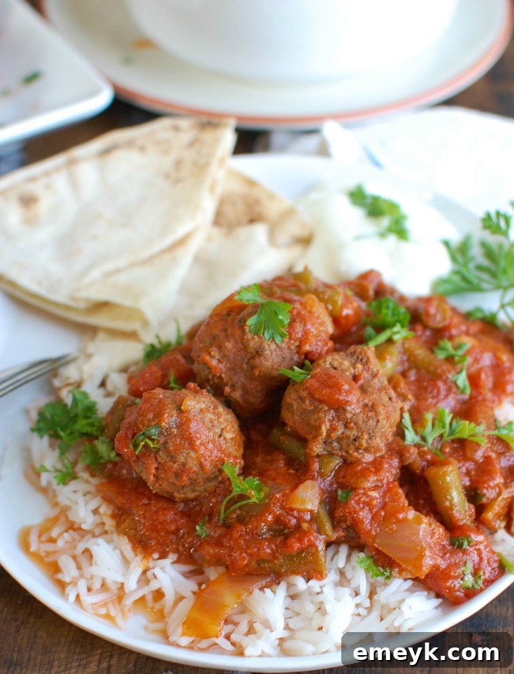 Another enticing view of Slow Cooker Mediterranean Beef Meatballs in their rich green bean sauce, ready for serving.