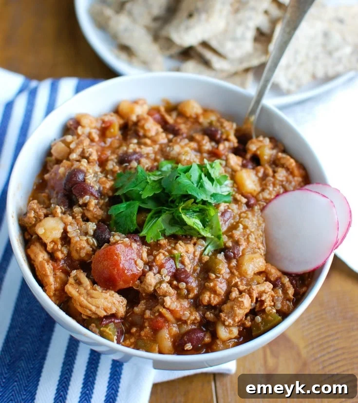 Nourishing Slow Cooker Turkey Quinoa Chili 3 Hearty Slow Cooker Turkey Quinoa Chili with vibrant toppings, a healthy and comforting crockpot meal.