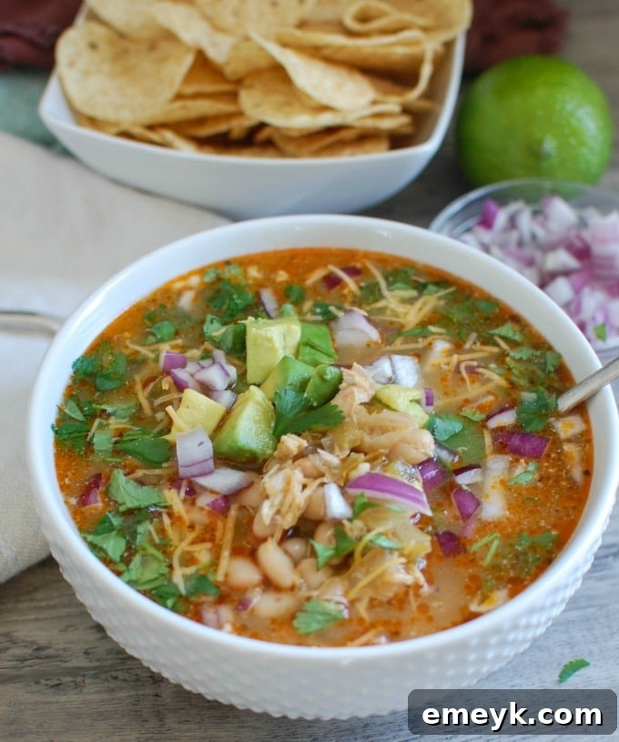Hearty Slow Cooker White Chicken Chili, a comforting soup packed with flavor and perfect for cold days or tailgating.