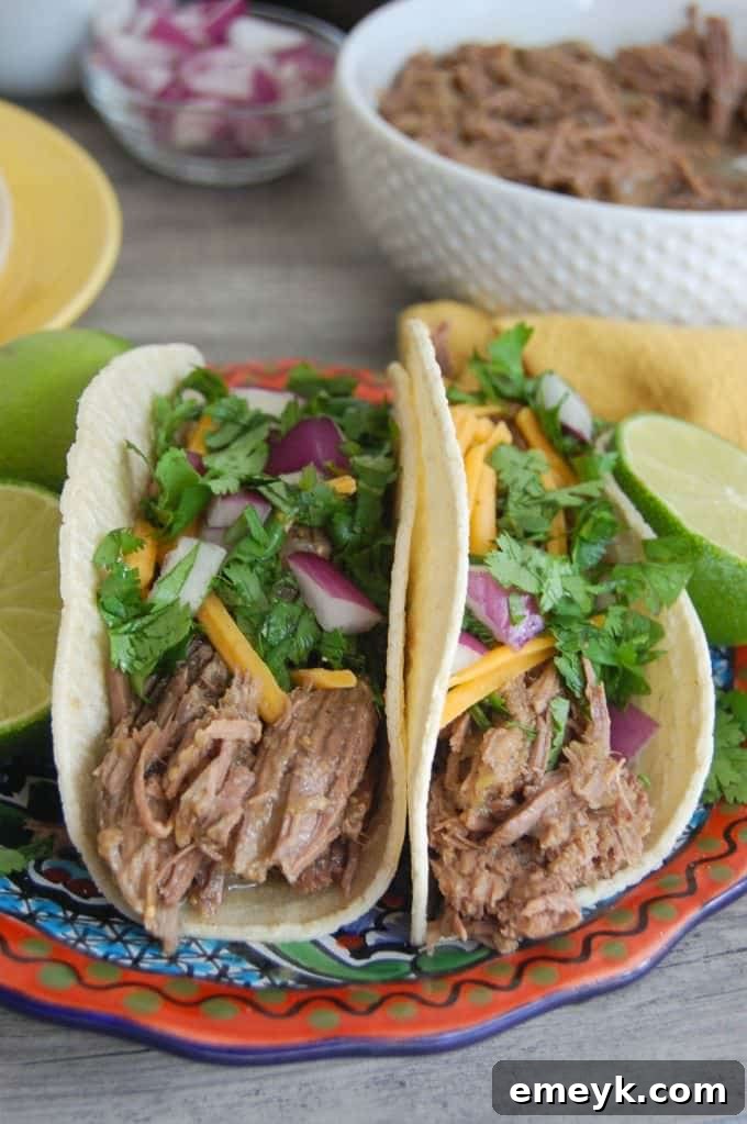 Simple and delicious Slow Cooker 4 Ingredient Shredded Beef Tacos, perfect for a busy weeknight meal.