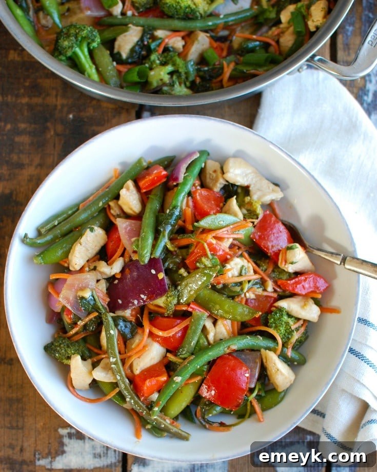 This Orange Chicken Vegetable Stir Fry is healthy, packed with a rainbow of vegetables and a light, sweet orange sauce. Forget take-out and make this version at home allowing you to customize it to your tastes!