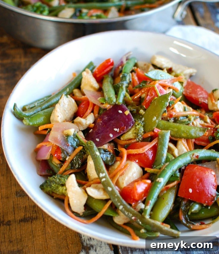 This Orange Chicken Vegetable Stir Fry is healthy, packed with a rainbow of vegetables and a light, sweet orange sauce. Forget take-out and make this version at home allowing you to customize it to your tastes!