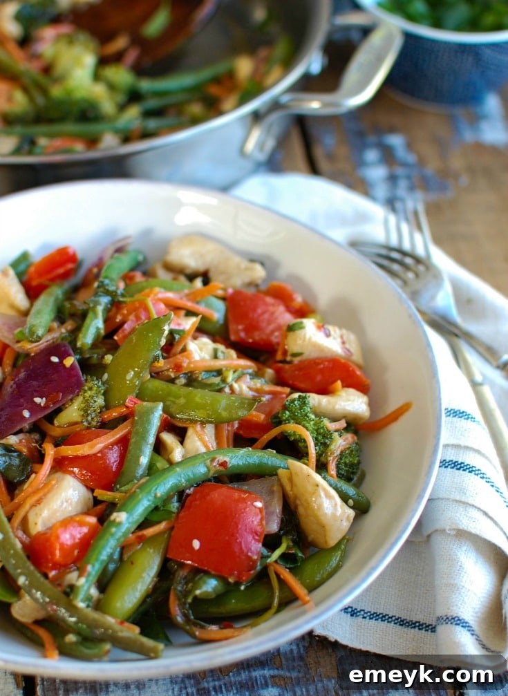 This Orange Chicken Vegetable Stir Fry is healthy, packed with a rainbow of vegetables and a light, sweet orange sauce. Forget take-out and make this version at home allowing you to customize it to your tastes! 