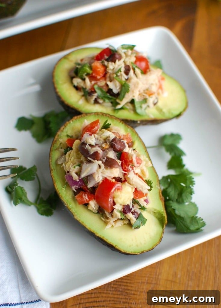 Mexican Tuna Stuffed Avocados mixes tuna, black beans, fresh vegetables, lime juice and spices to create a healthy and easy snack or lunch that is also heart healthy.