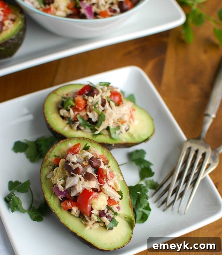 Mexican Tuna Stuffed Avocados mixes tuna, black beans, fresh vegetables, lime juice and spices to create a healthy and easy snack or lunch that is also heart healthy.