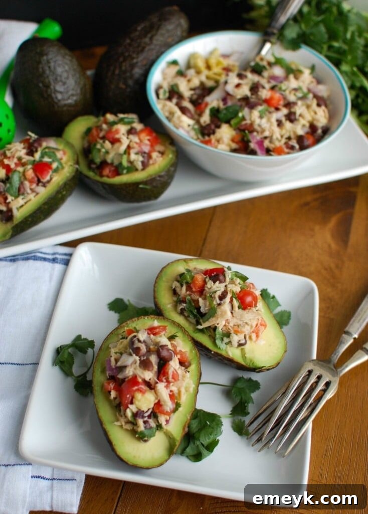 Mexican Tuna Stuffed Avocados mixes tuna, black beans, fresh vegetables, lime juice and spices to create a healthy and easy snack or lunch that is also heart healthy.