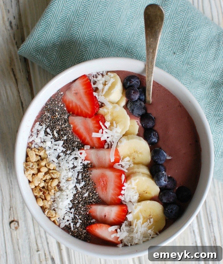 A close-up of a Chia Seeds Fruit Bowl, featuring sliced bananas and a generous sprinkle of chia seeds as toppings.