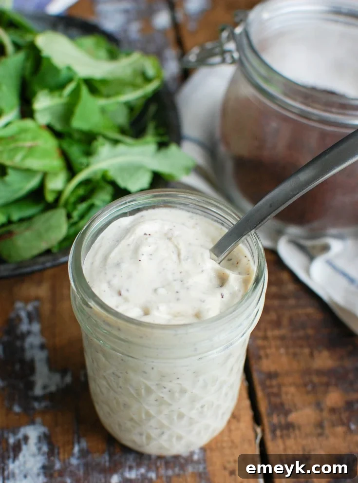 Creamy Tahini Yogurt Dressing in a glass jar, perfect for healthy salads and Mediterranean dishes.