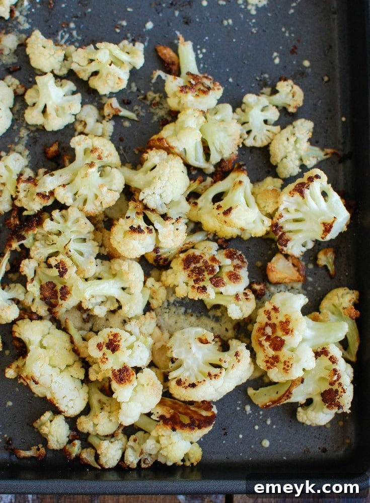Roasted Parmesan Garlic Cauliflower is a new way to eat cauliflower. Roasted cauliflower is sweet and pairs nicely with parmesan cheese and garlic. 