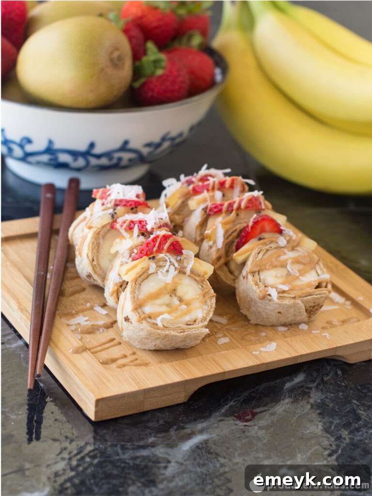 Irresistible Banana Sushi Rolls with sliced strawberries and kiwi, perfect for kids