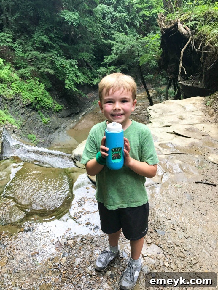 Sip Smart, Stay Healthy with Gululu 7 A child joyfully drinking water, symbolizing healthy hydration and active living