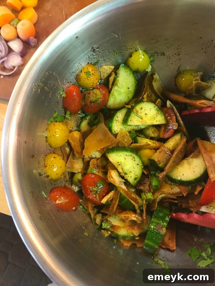 Close-up of Fattoush salad featuring cilantro and pomegranate molasses, offering a unique flavor profile.