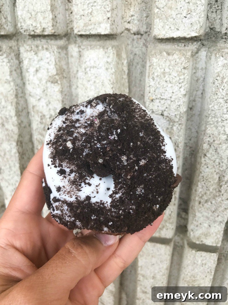 A close-up of various donuts, showcasing their intricate toppings and delicious appearance.