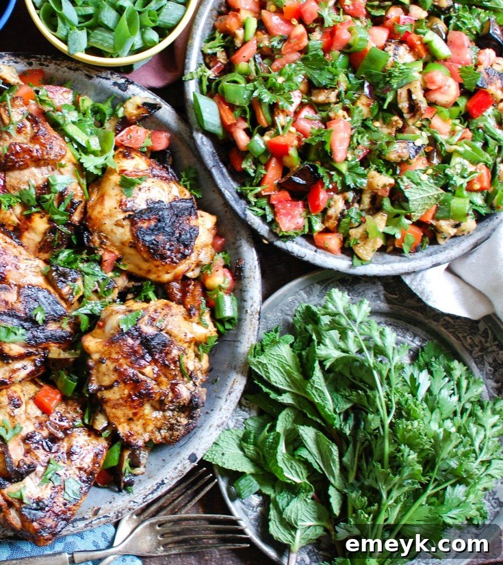 Vibrant Mediterranean Eggplant Salad 6 Mediterranean Eggplant Salad served alongside grilled chicken and lemon wedges, showcasing a complete meal idea.