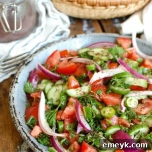 Persian Tomato Cucumber Salad, a refreshing side dish with diced tomatoes, cucumbers, and herbs.