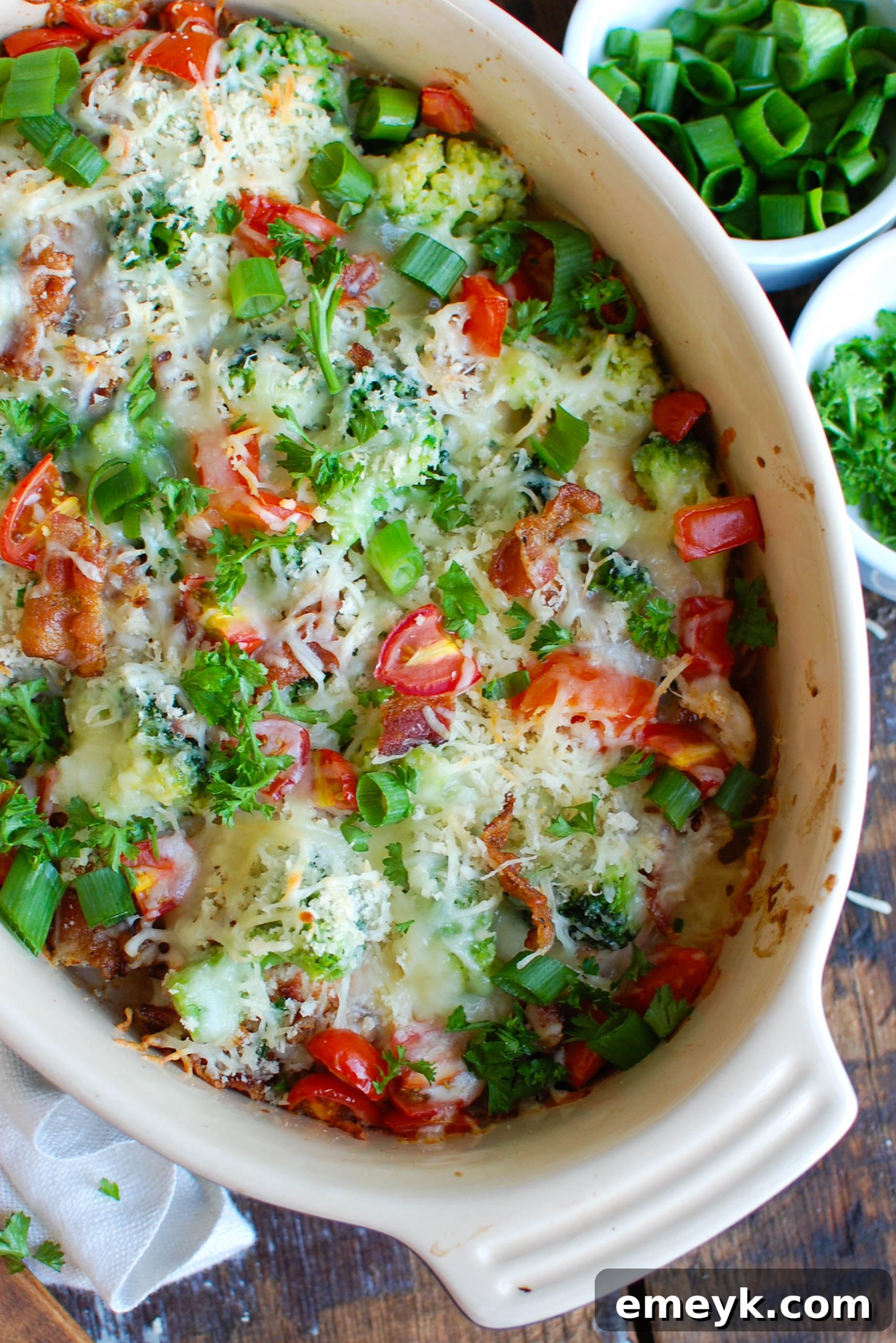 Cheesy Chicken and Broccoli Bake 2 A beautifully presented casserole dish filled with golden-brown Baked Broccoli Cheese Chicken, garnished with fresh herbs, ready to serve.