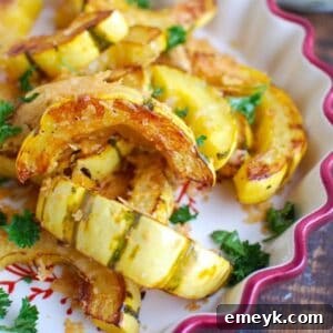 Parmesan Roasted Delicata 5 A serving of roasted Parmesan delicata squash, garnished with fresh parsley.