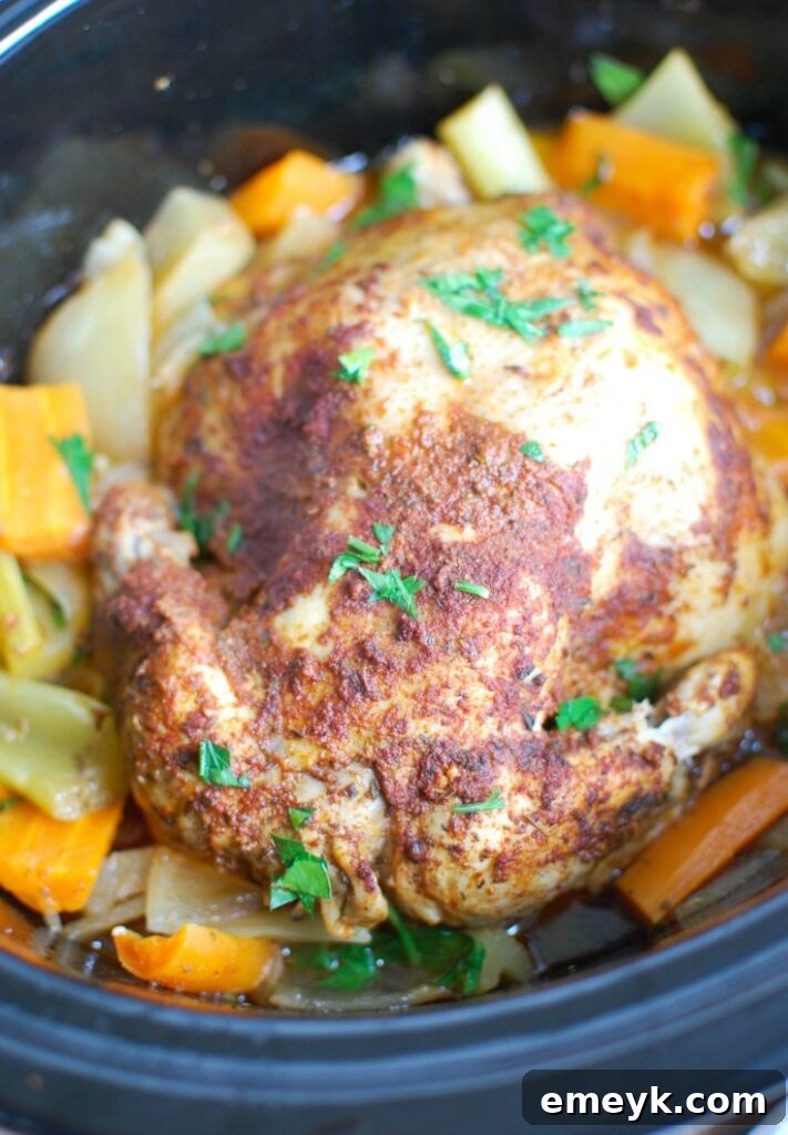 Sun-Kissed Mediterranean Slow Cooker Whole Chicken 4 Close-up of a whole chicken being generously rubbed with Mediterranean spices on a cutting board, ready for the slow cooker.