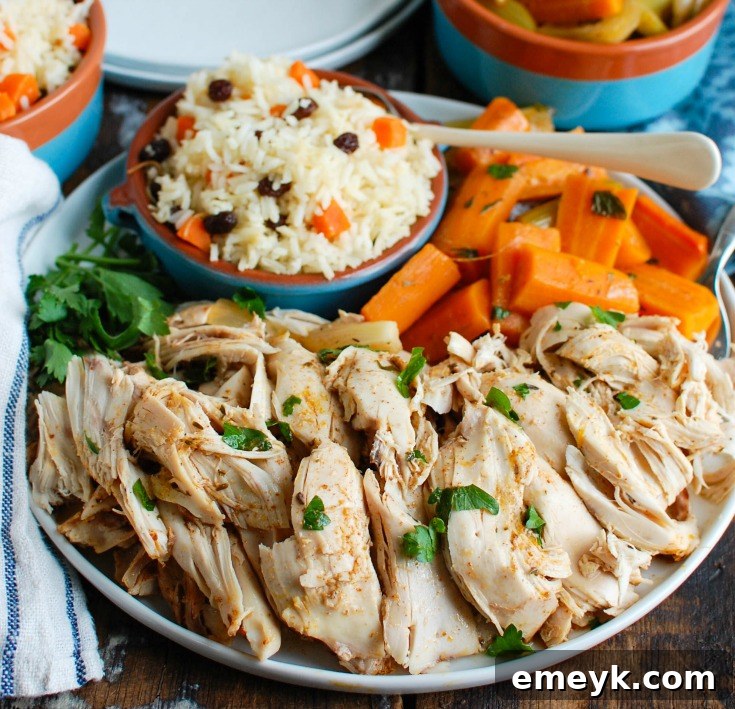 Sun-Kissed Mediterranean Slow Cooker Whole Chicken 5 A perfectly cooked Slow Cooker Mediterranean Whole Chicken, golden brown and falling off the bone, ready to be shredded.