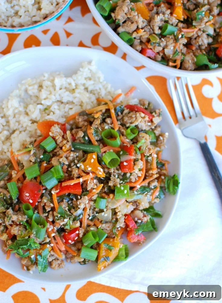 Delicious Easy Thai Pork Stir-Fry with ground pork and colorful vegetables served over fluffy white rice