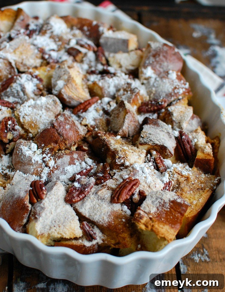A beautifully baked Overnight Gingerbread French Toast Casserole, golden brown with a streusel topping, ready to be served for a festive holiday breakfast or brunch.
