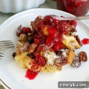A top-down view of the prepared Overnight Gingerbread French Toast Casserole, showcasing its golden-brown streusel topping and delicious texture.