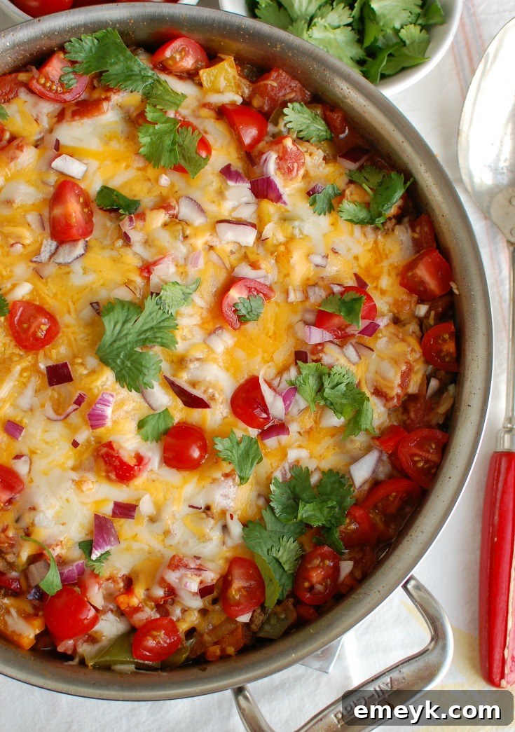 One Pot Mexican Stuffed Pepper Casserole in a baking dish, garnished with fresh cilantro.