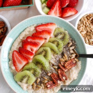 A vibrant Strawberry Kiwi Chia Seed Oat Bran Bowl, captured from above, showcasing the healthy and delicious combination of fresh fruit, seeds, and grains, ready to be savored.