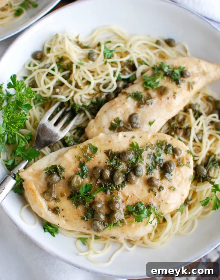 Zesty Lemon Caper Chicken 3 Close-up of Chicken Piccata garnished with fresh parsley, highlighting the golden chicken and rich sauce.