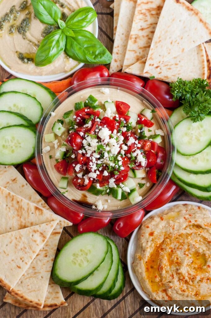 Snag a tub of your favorite hummus and whip up this Mediterranean Bruschetta Hummus topped with tomato, cucumber and feta.Hummus snack platter for a tasty pre-dinner nosh that's sure to satisfy!