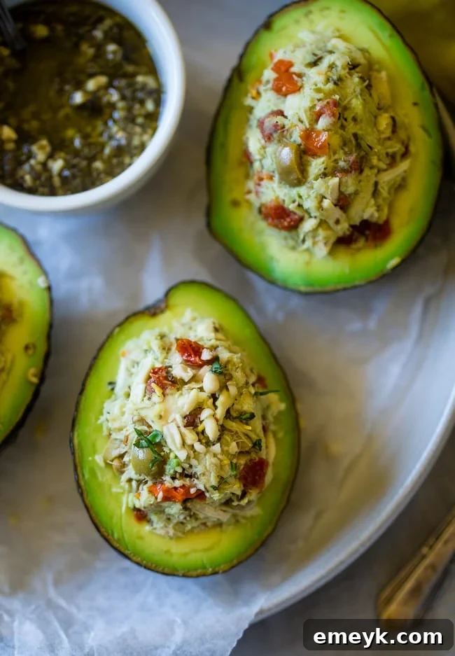 This healthy tuna salad has a Mediterranean twist and is served in a stuffed avocado! It has no mayo and is an easy, gluten free and low carb meal with only 6 ingredients!