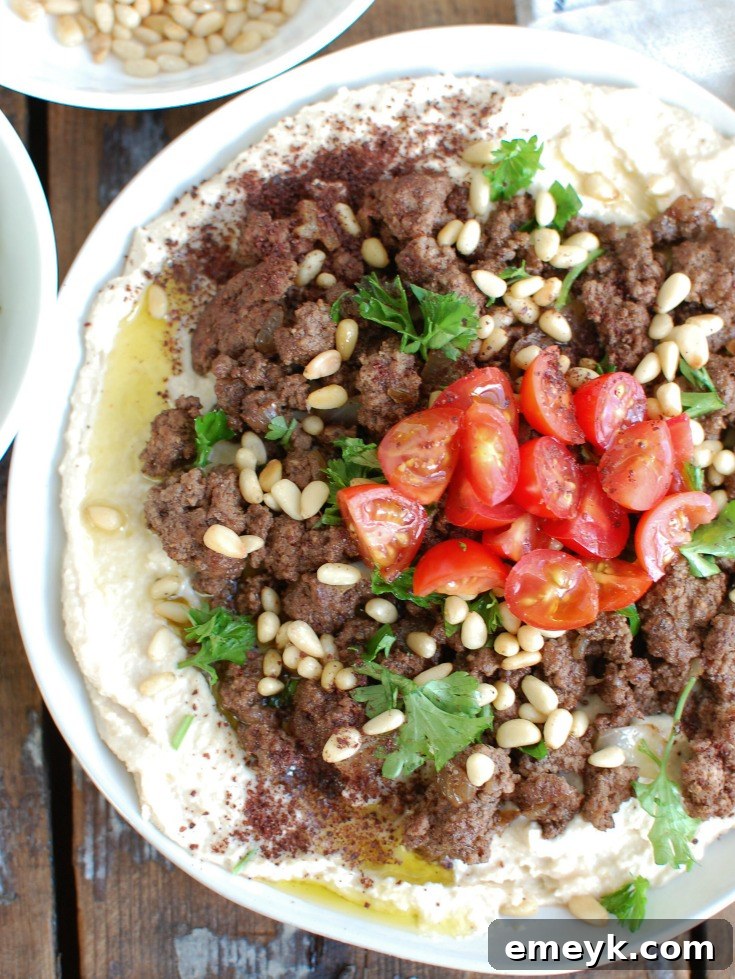 A selection of fresh ingredients and spices laid out for making Hummus with Spiced Beef and Toasted Pine Nuts.