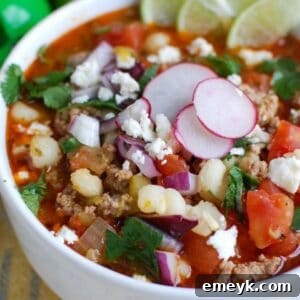 Slow Cooker Pork Pozole in a white bowl