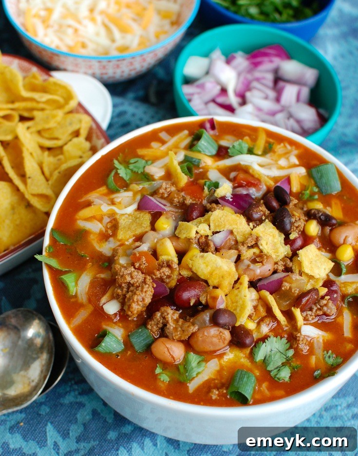 Zesty Instant Pot Taco Soup 5 A bowl of Instant Pot Taco Soup served with crunchy tortilla chips on the side, ready for dipping.