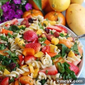 Spring Pasta Salad in a bowl, a fresh and colorful dish perfect for any occasion.