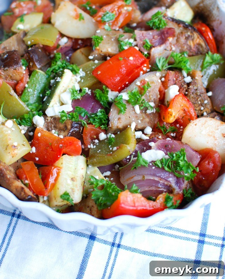Greek Roasted Vegetables {Briami} are tender, flavorful vegetables that are roasted in a tomato based sauce and topped with fresh parsley and feta cheese. These vegetables work great over rice, paired with pasta or as a side dish to your meal.
